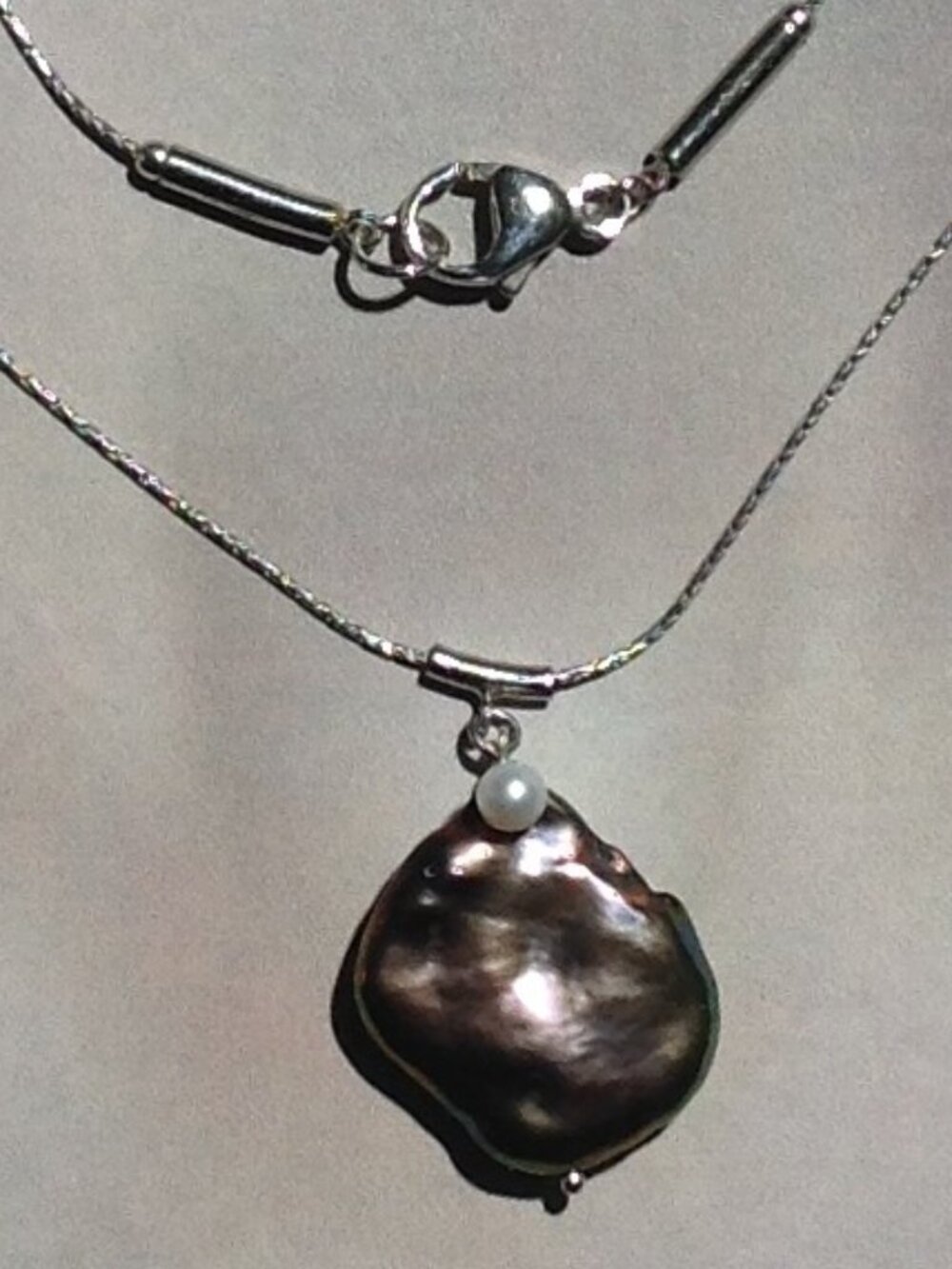 Sterling Silver Chain with Baroque Flat Freshwater pendant.